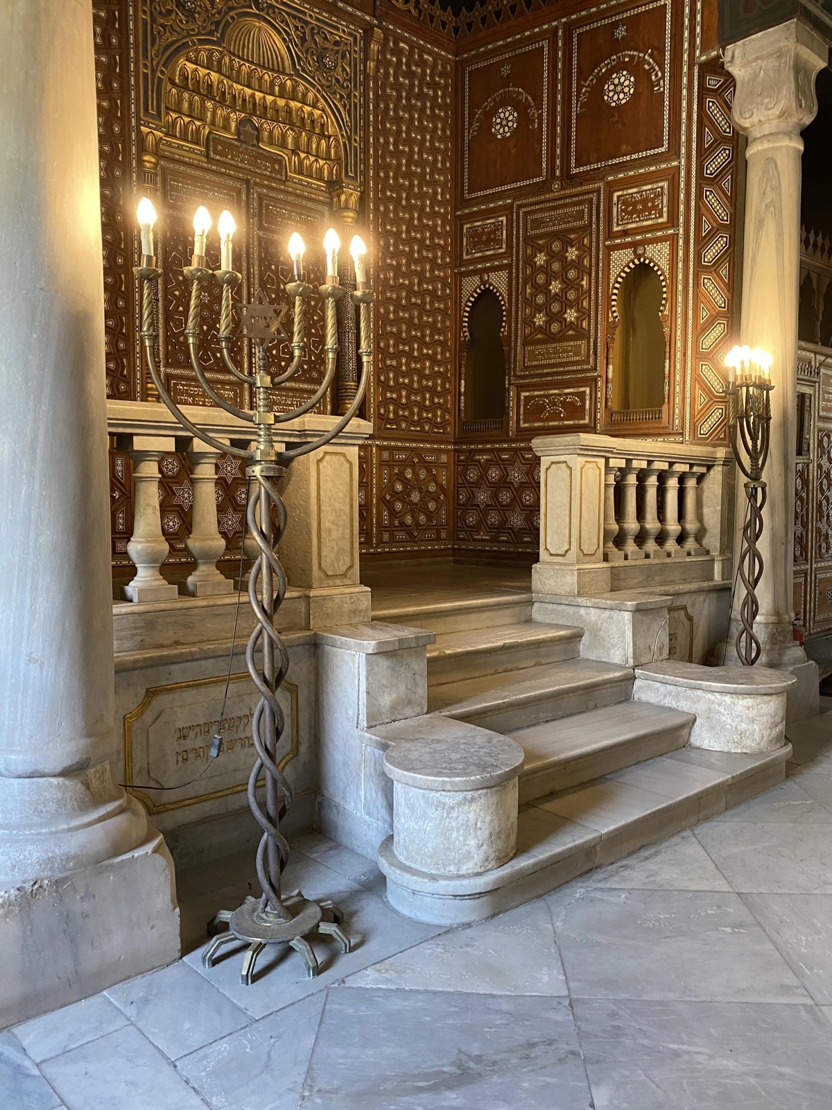 Ornate ark and menorah inside Ben Ezra Synagogue