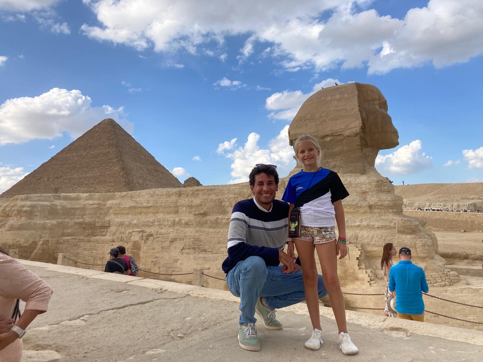 Wayfinder guide and young guest beside the Great Sphinx