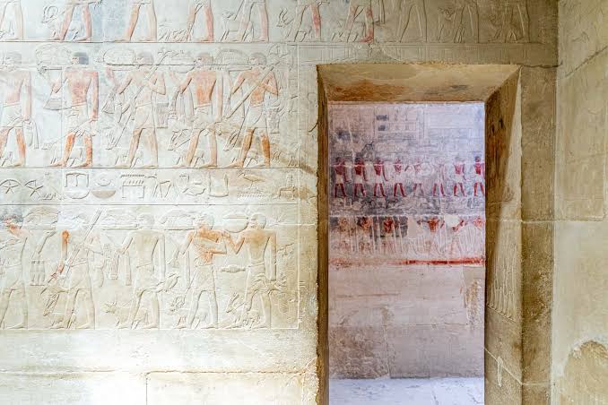 Painted reliefs inside a tomb at Saqqara